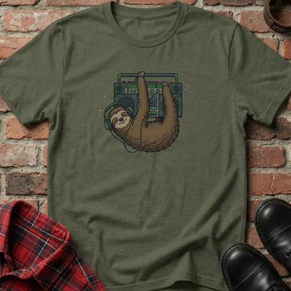 Green t-shirt with a sloth holding a boombox graphic on a brick surface. Minimalist music apparel by pemuyo.