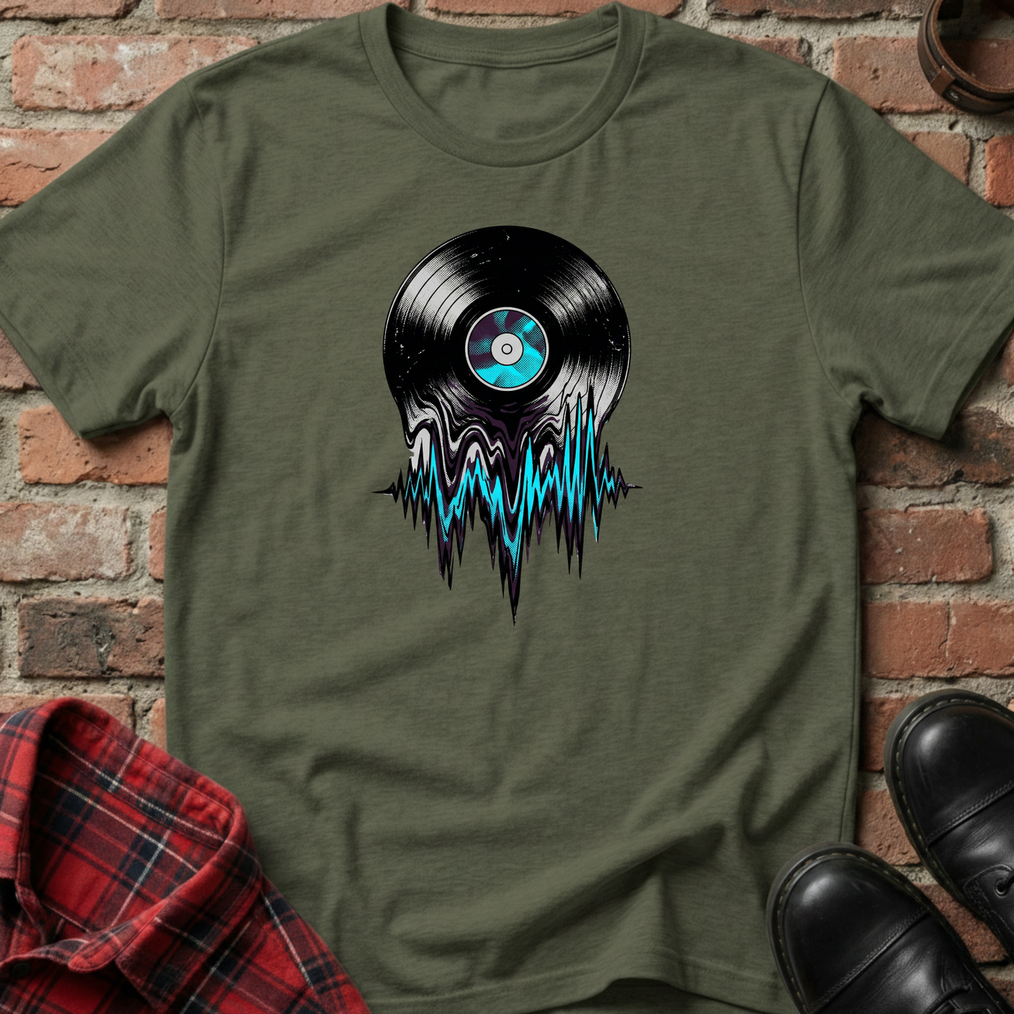 Green t-shirt with vinyl record design on a brick wall background. Minimalist music apparel by pemuyo.