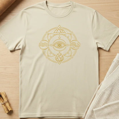 Beige t-shirt with a gold geometric design on a wooden surface. Minimalist yoga apparel by pemuyo.