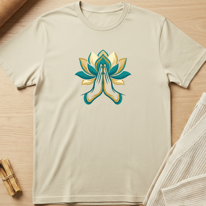 Beige t-shirt with a colorful lotus flower design on a wooden surface. Minimalist yoga apparel by pemuyo.