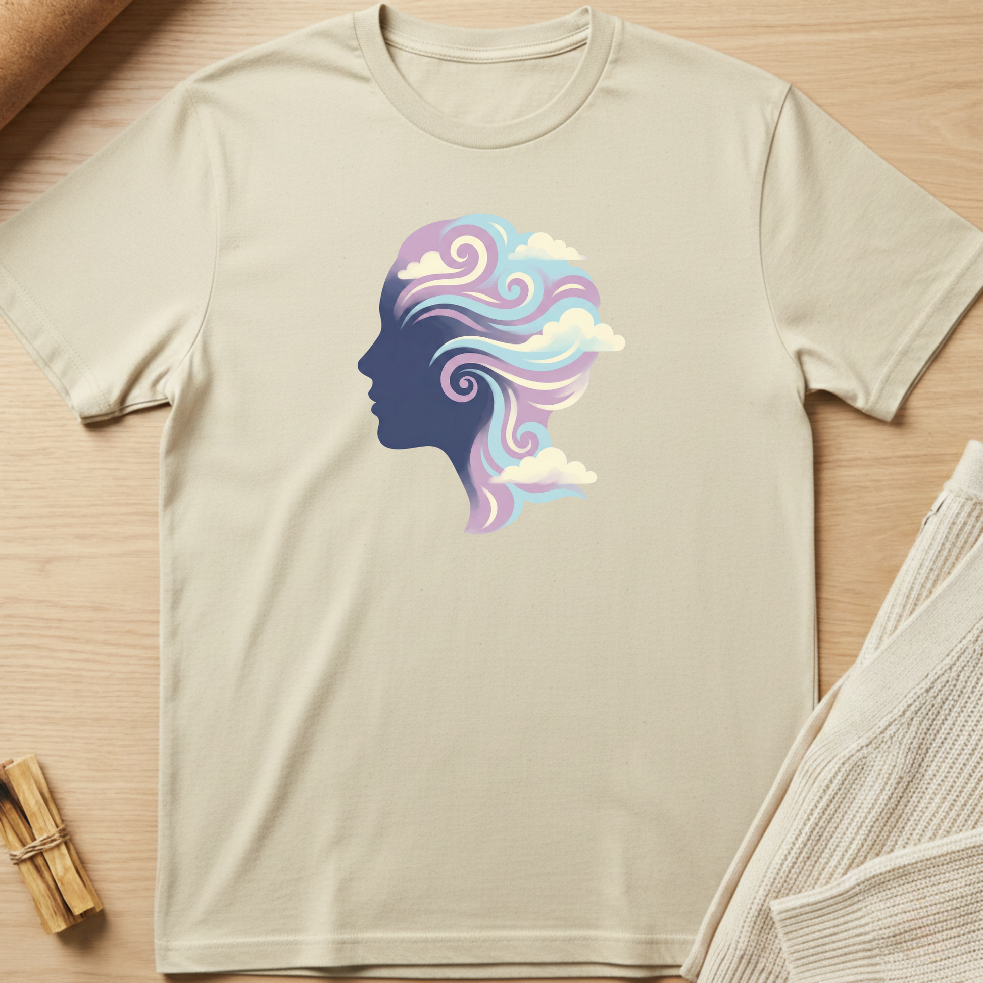 T-shirt with a colorful graphic of a face on a wooden surface. Minimalist yoga apparel by pemuyo.