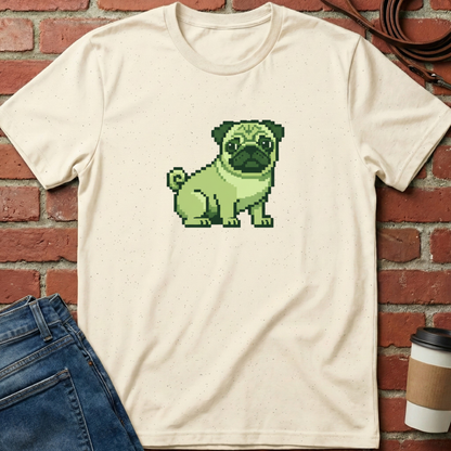 Beige t-shirt with a pixelated green pug design against a brick wall. Minimalist dog apparel by pemuyo.