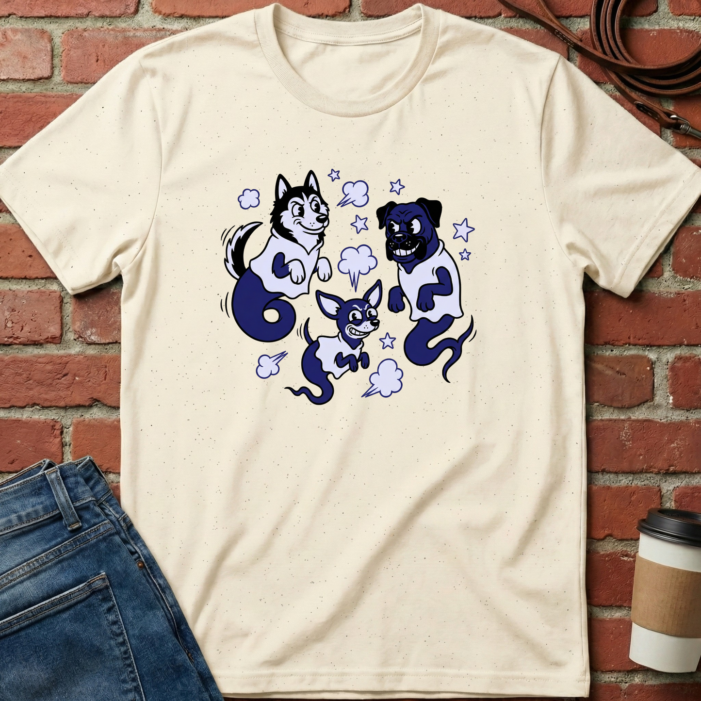 Beige t-shirt with cartoon dog design on a brick wall background. Minimalist dog apparel by pemuyo.
