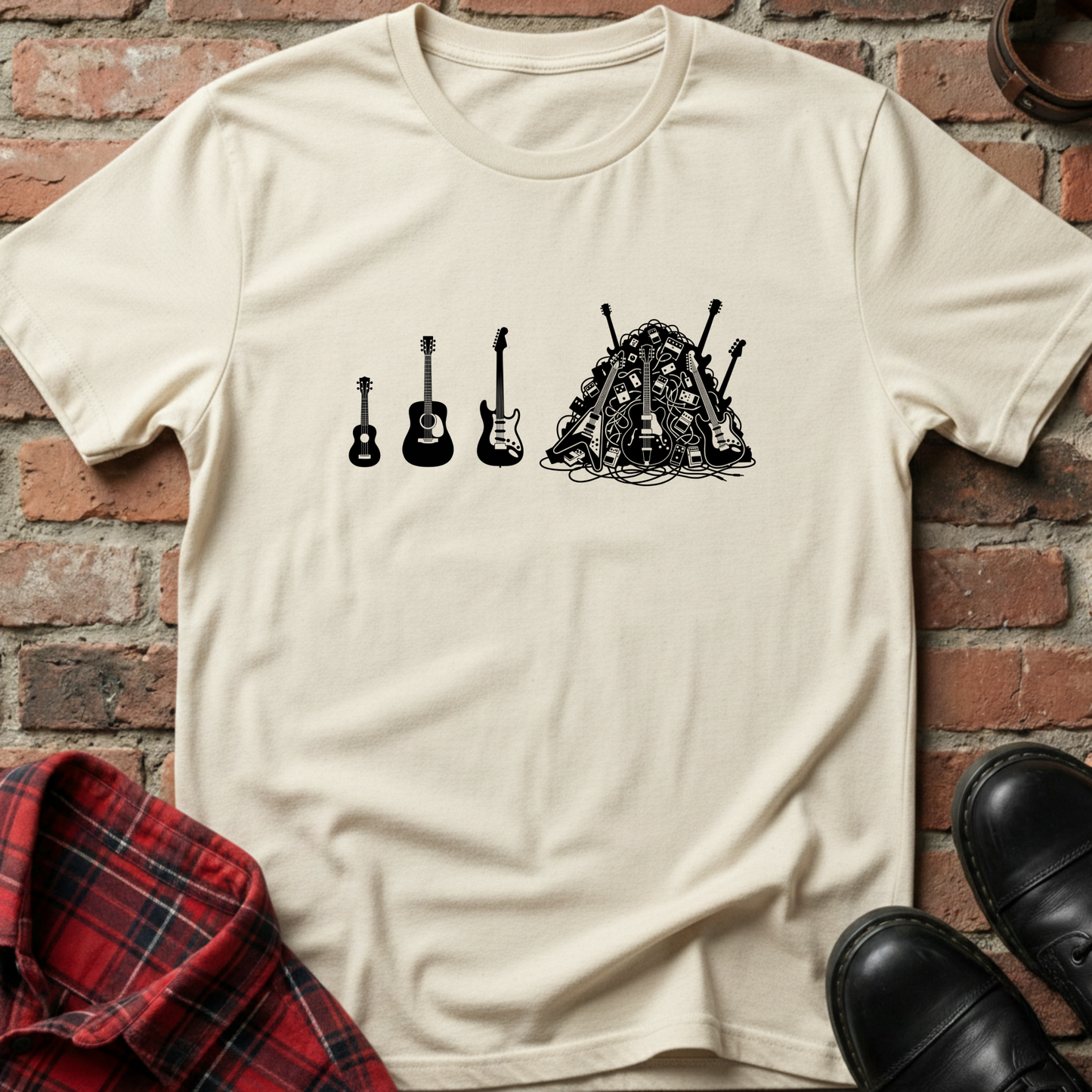 Beige t-shirt with black graphic design of guitars on a brick wall background. Minimalist music apparel by pemuyo.