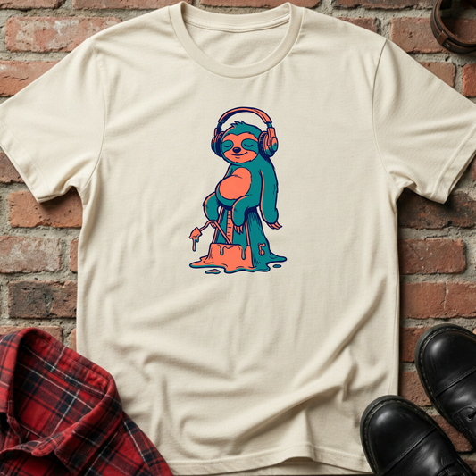 Beige t-shirt with a colorful sloth graphic wearing headphones against a brick wall. Minimalist music apparel by pemuyo.