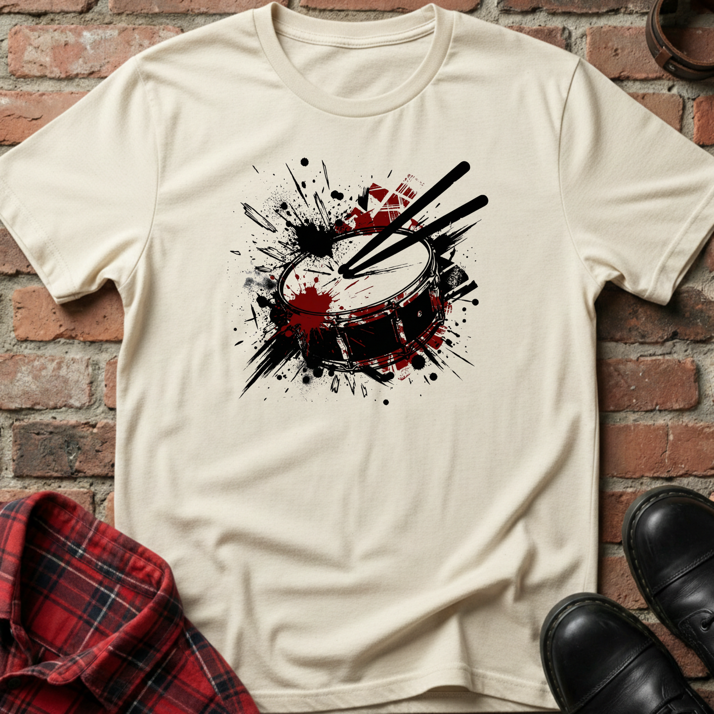 White t-shirt with a drum design on a brick background. Minimalist music apparel by pemuyo.