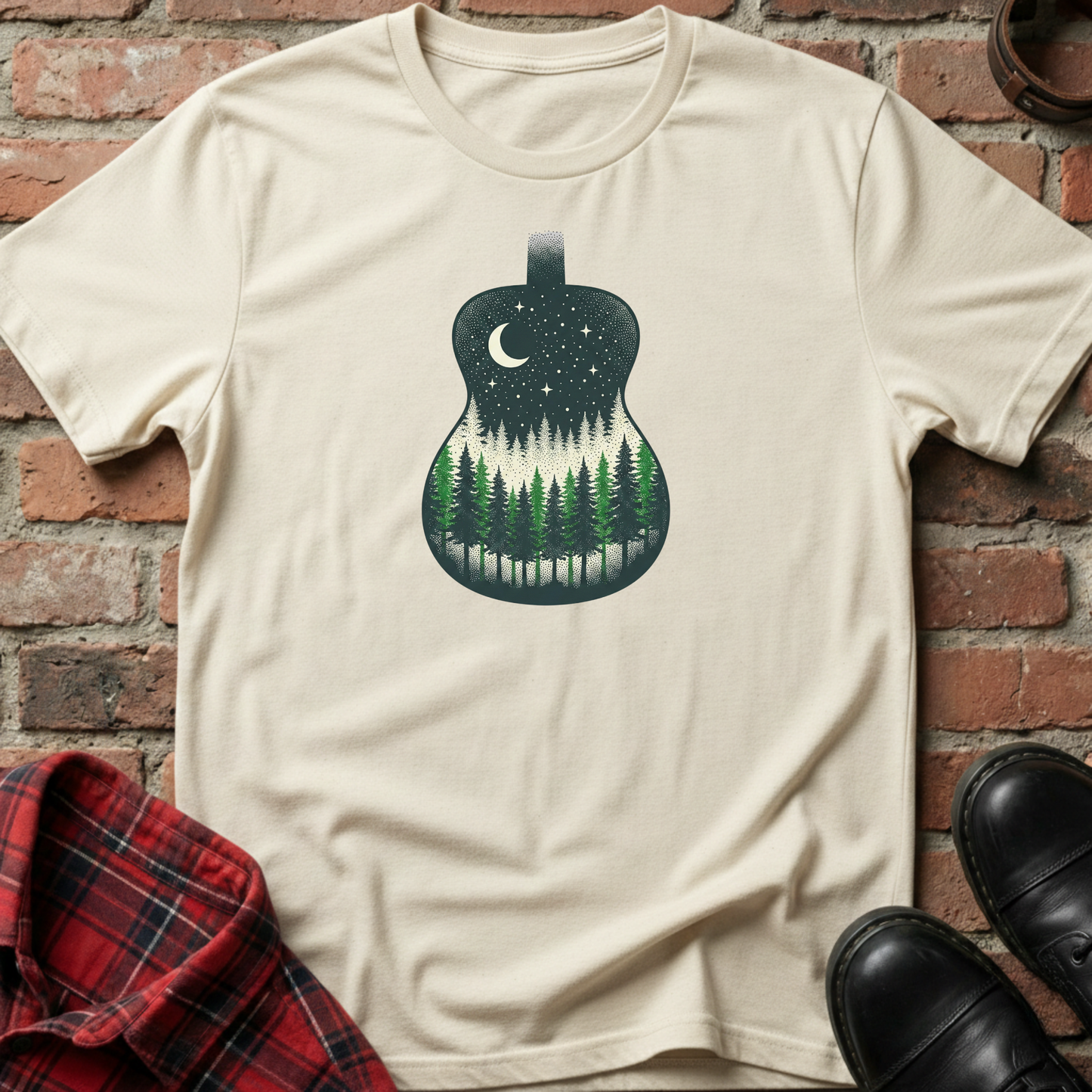 Beige t-shirt with guitar and forest design on a brick surface. Minimalist music apparel by pemuyo.