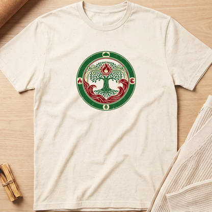 An off-white short-sleeve t-shirt laid flat on a light wood background, featuring a circular green and red tree of life graphic printed on the chest. Minimalist yoga apparel by pemuyo.