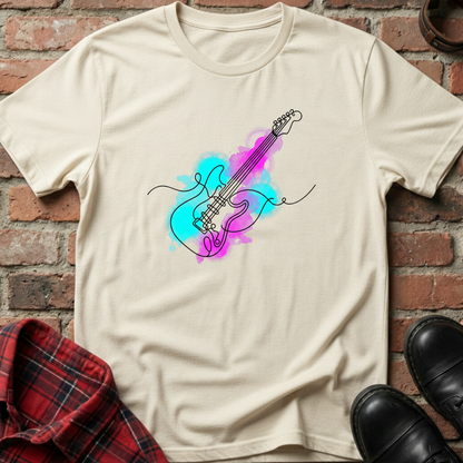 Beige t-shirt with a colorful guitar design on a brick wall background. Minimalist music apparel by pemuyo.