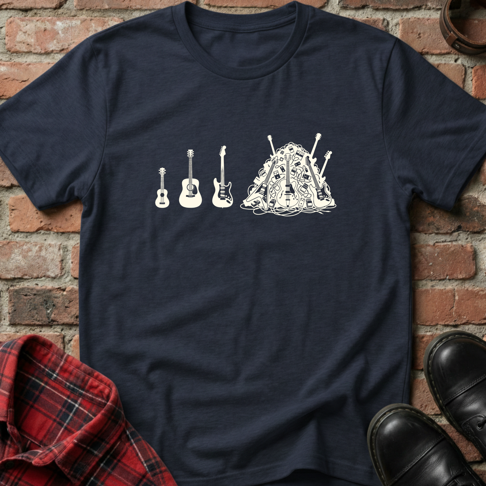 Navy blue t-shirt with white graphic design of guitars on a brick background. Minimalist music apparel by pemuyo.