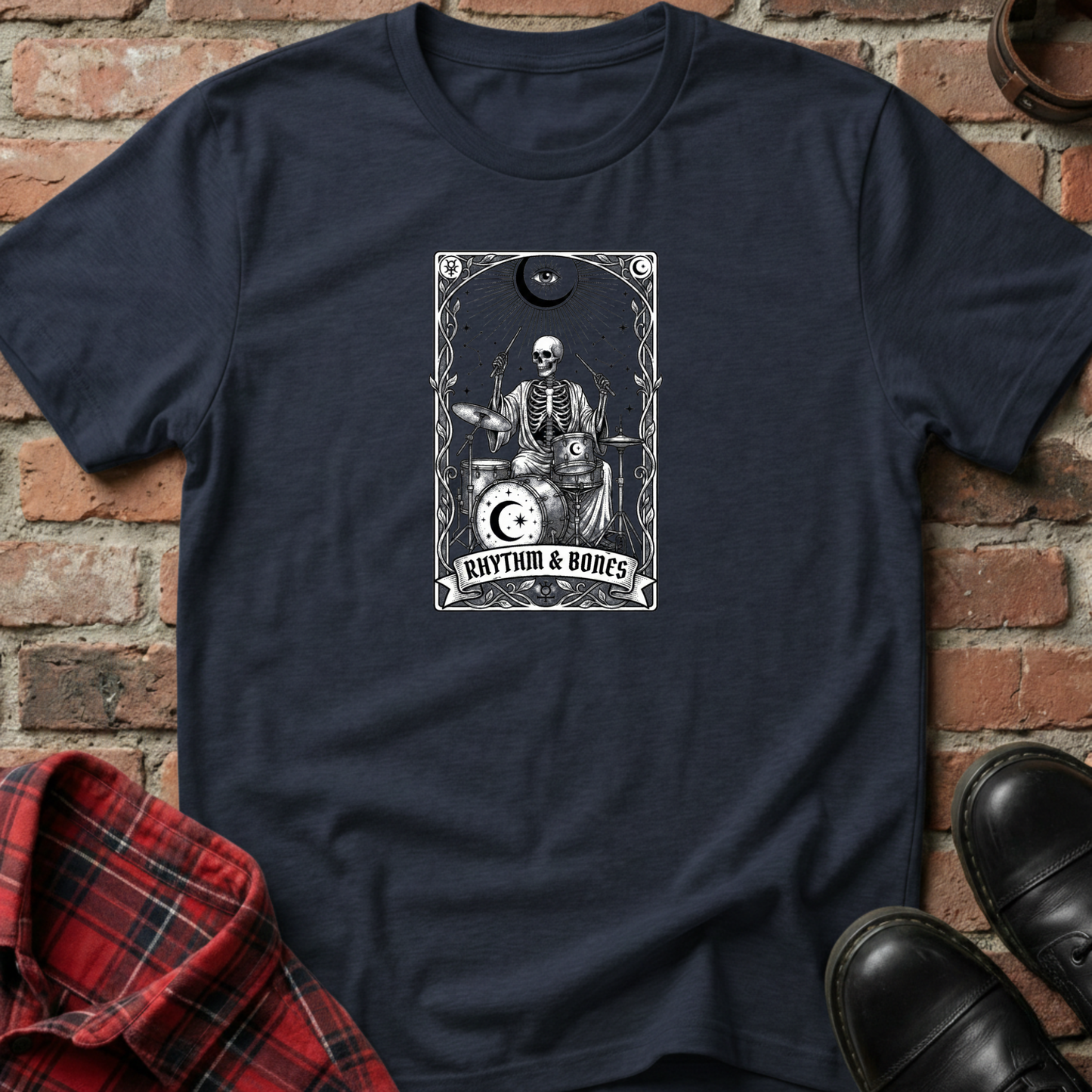 Navy blue t-shirt with skeleton playing drums graphic on a brick wall background. Minimalist music apparel by pemuyo.