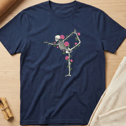 Navy blue t-shirt with a skeleton and floral design on a wooden surface. Minimalist yoga apparel by pemuyo.