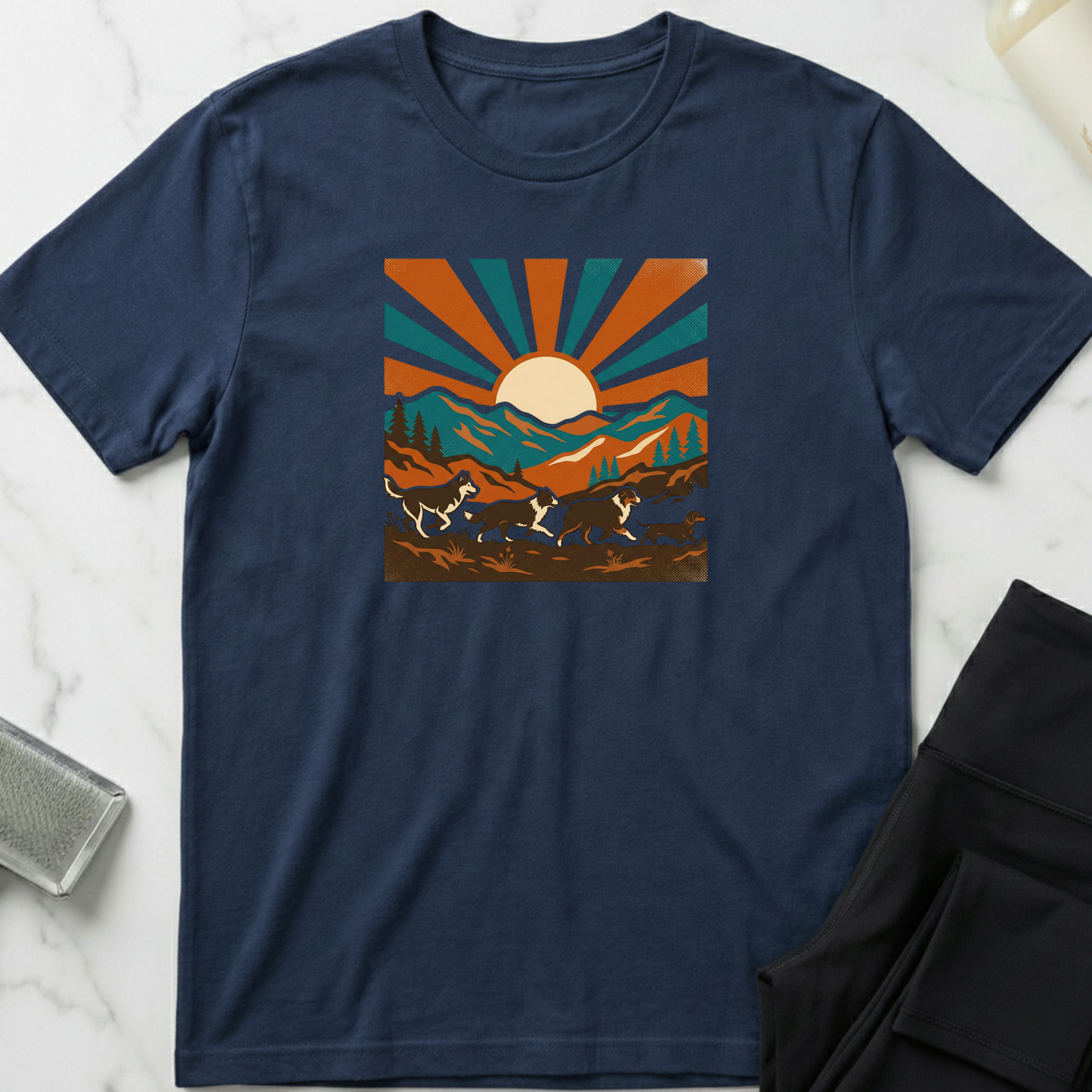 Navy blue t-shirt with a graphic design of mountains and sun on a marble surface. Minimalist dog apparel by pemuyo.