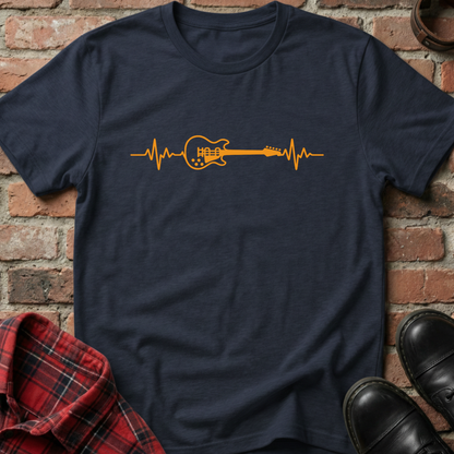 Navy blue t-shirt with orange guitar heartbeat design on a brick background. Minimalist music apparel by pemuyo.