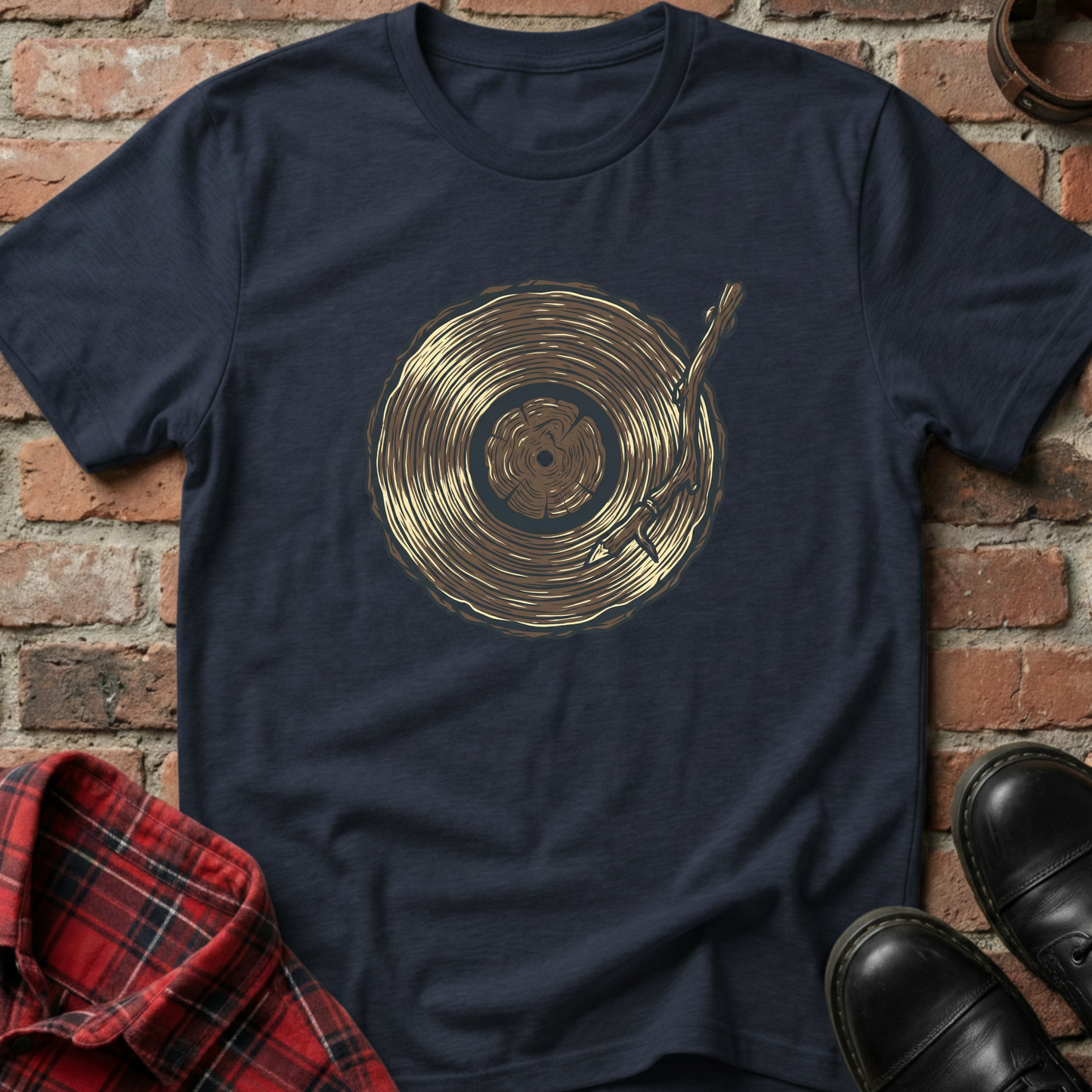 Navy blue t-shirt with gold vinyl record design on a brick background. Minimalist music apparel by pemuyo.