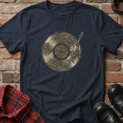 Navy blue t-shirt with gold vinyl record design on a brick background. Minimalist music apparel by pemuyo.