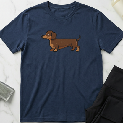 Navy blue t-shirt with a pixelated dachshund graphic on a marble surface. Minimalist dog apparel by pemuyo.
