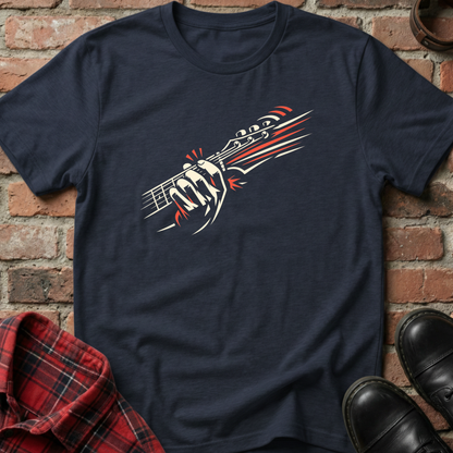 Navy blue t-shirt with a graphic design of a gun and bullet on a brick background. Minimalist music apparel by pemuyo.