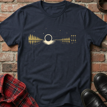 Navy blue t-shirt with a gold graphic design on a brick background. Minimalist music apparel by pemuyo.