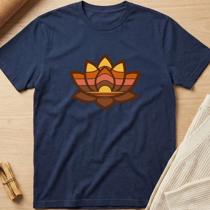 Navy blue t-shirt with a colorful lotus flower design on a wooden surface. Minimalist yoga apparel by pemuyo.