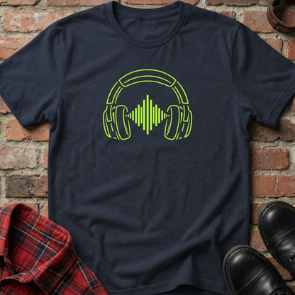 Navy blue t-shirt with green headphone design on a brick surface. Minimalist music apparel by pemuyo.