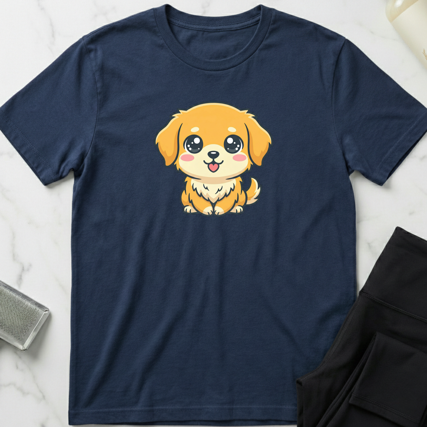 Navy blue t-shirt with a cartoon dog design on a marble surface. Minimalist dog apparel by pemuyo.