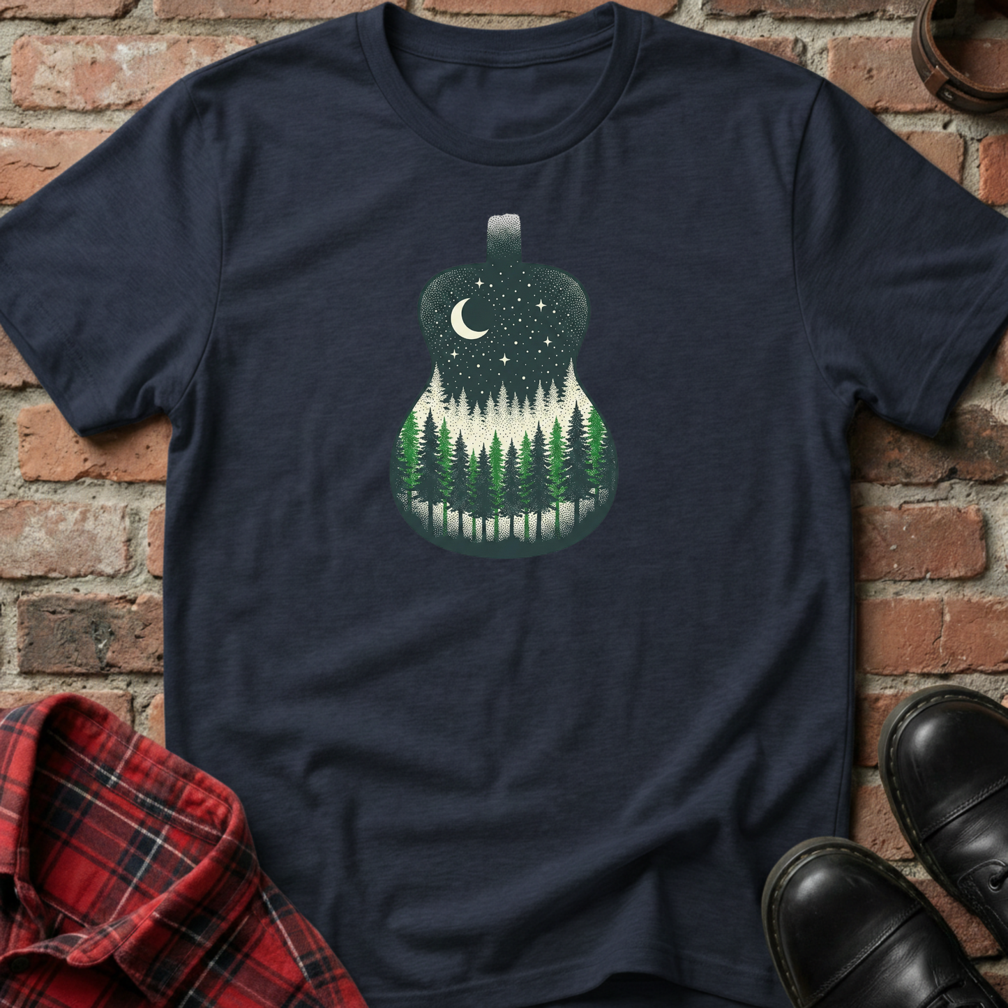 Navy blue t-shirt with a forest design on a brick wall background. Minimalist music apparel by pemuyo.