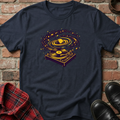 Navy blue t-shirt with a yellow and purple graphic design on a brick surface. Minimalist music apparel by pemuyo.