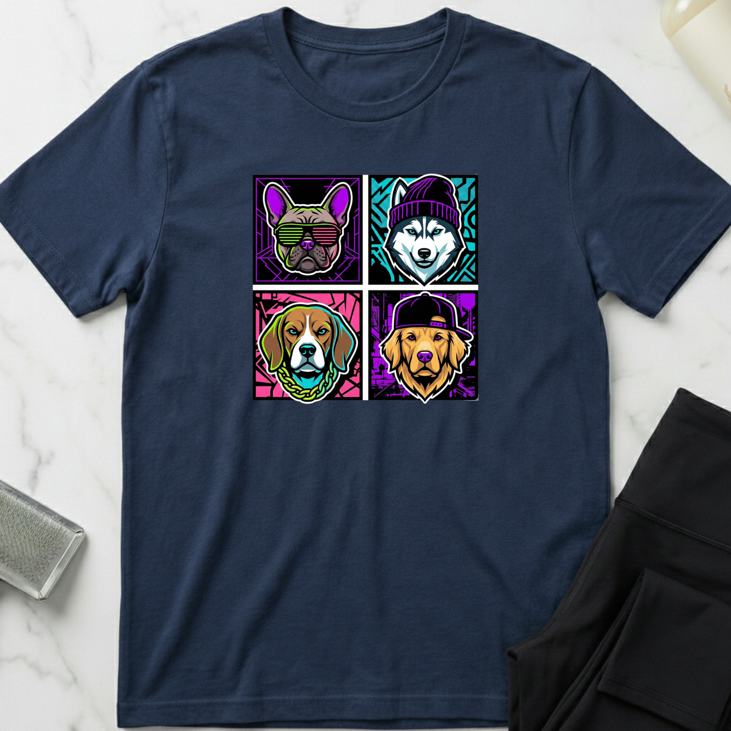 Navy blue t-shirt with colorful dog graphic designs on a marble surface. Minimalist dog apparel by pemuyo.