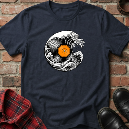 Navy blue t-shirt with vinyl record design on a brick wall background. Minimalist music apparel by pemuyo.