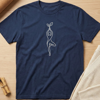 Navy blue t-shirt with a white abstract design on a wooden surface. Minimalist yoga apparel by pemuyo.