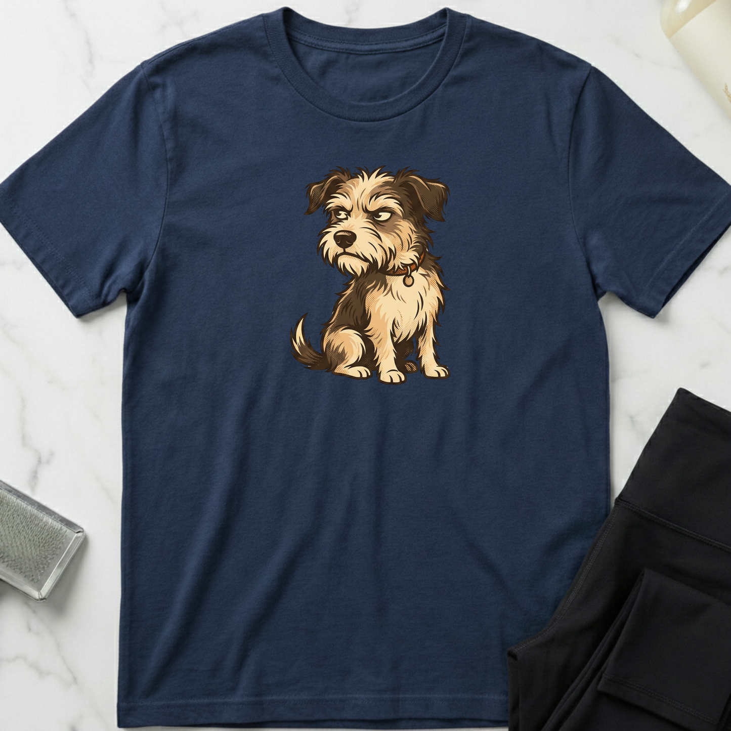 Navy blue t-shirt with a dog graphic on a marble surface. Minimalist dog apparel by pemuyo.