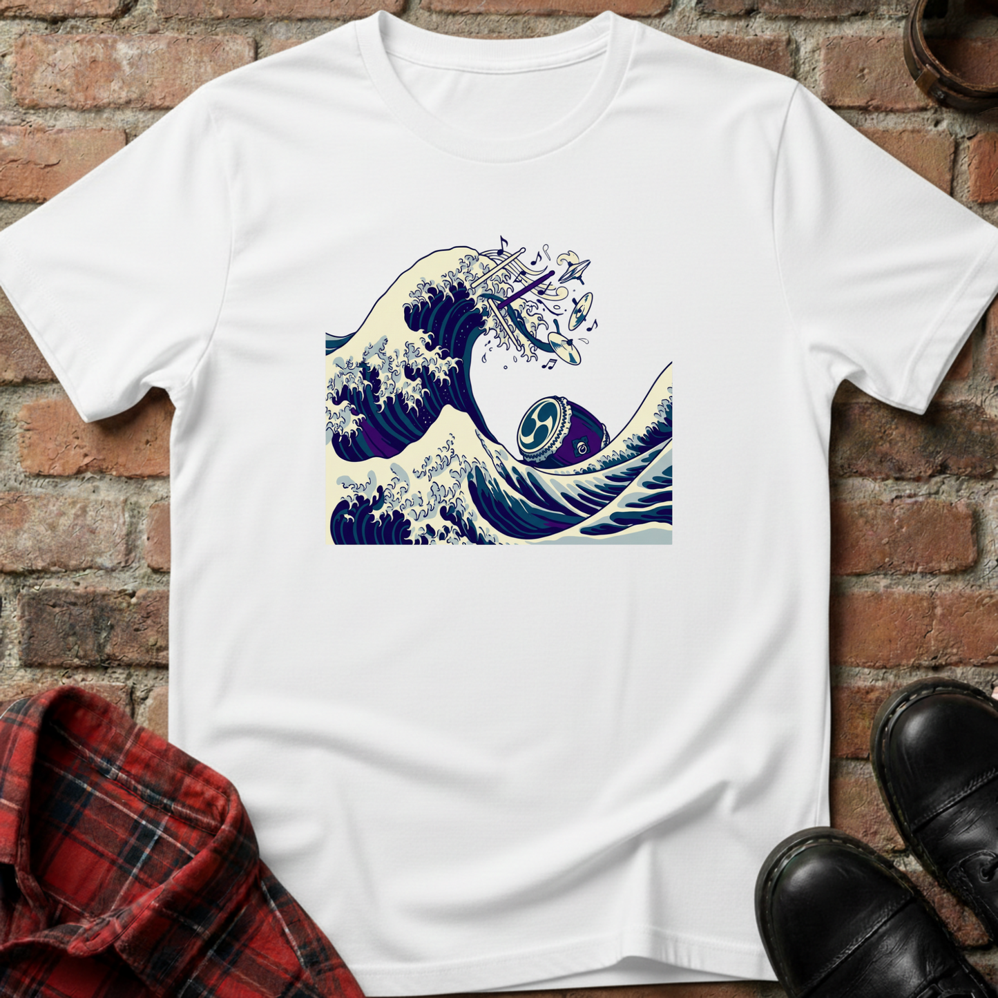 White t-shirt with a wave design on a brick surface. Minimalist music apparel by pemuyo.