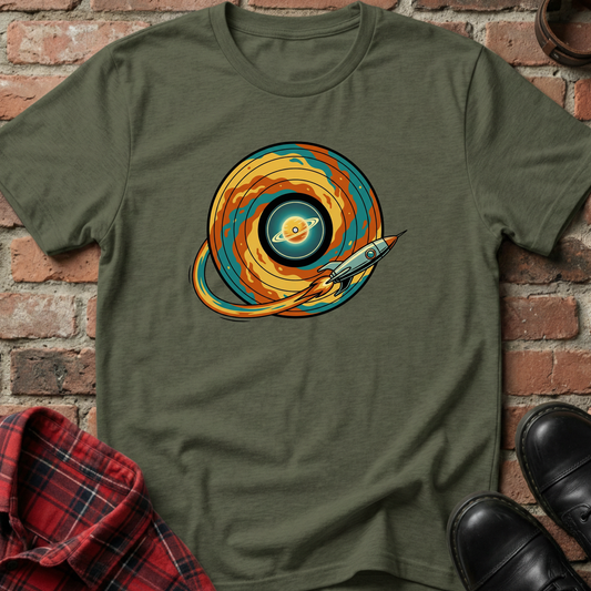 Green t-shirt with space-themed design on a brick wall background. Minimalist music apparel by pemuyo.