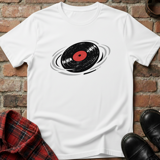 White t-shirt with vinyl record design on a brick surface. Minimalist music apparel by pemuyo.