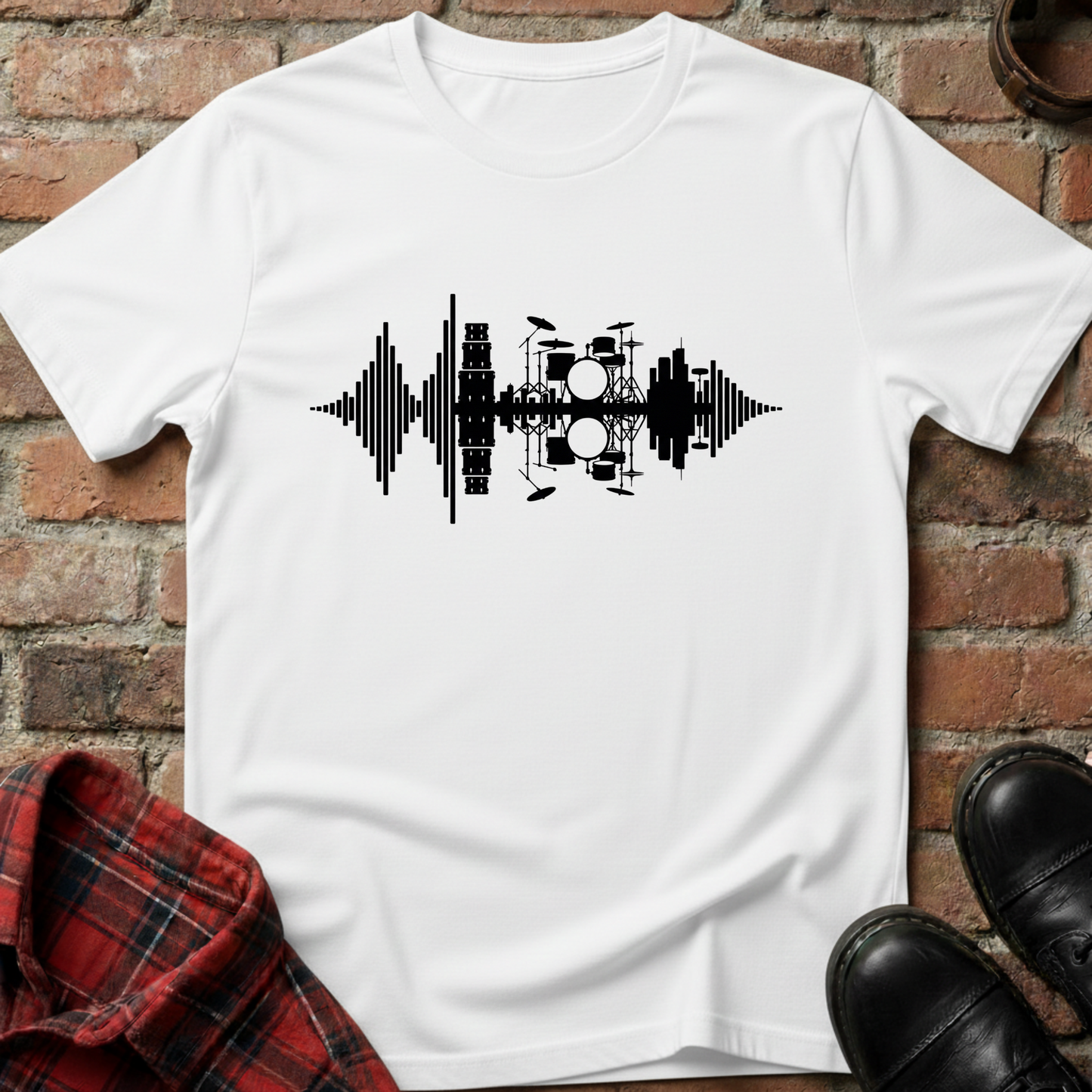 White t-shirt with black musical instrument graphic on a brick surface. Minimalist music apparel by pemuyo.