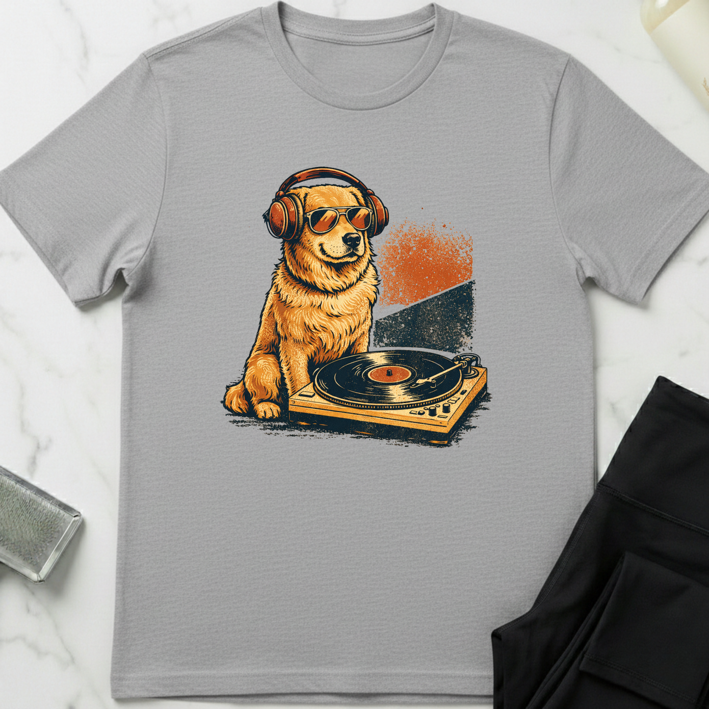 Gray t-shirt with a dog wearing headphones and sunglasses on a turntable graphic. Minimalist dog apparel by pemuyo.