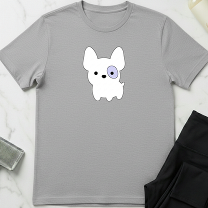 Gray t-shirt with a cartoon dog graphic on a marble surface. Minimalist dog apparel by pemuyo.
