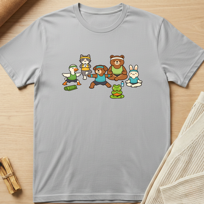 Gray t-shirt with cartoon characters on a wooden surface. Minimalist yoga apparel by pemuyo.