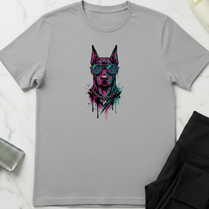 Gray t-shirt with a graphic of a dog wearing sunglasses on a white marble surface. Minimalist dog apparel by pemuyo.
