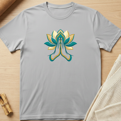 Gray t-shirt with a colorful lotus flower design on a wooden surface. Minimalist yoga apparel by pemuyo.