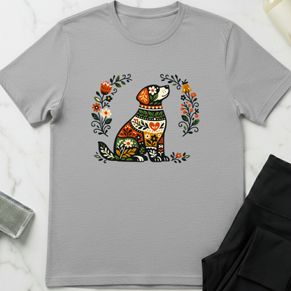 Gray t-shirt with a colorful dog illustration on a white marble surface. Minimalist dog apparel by pemuyo.