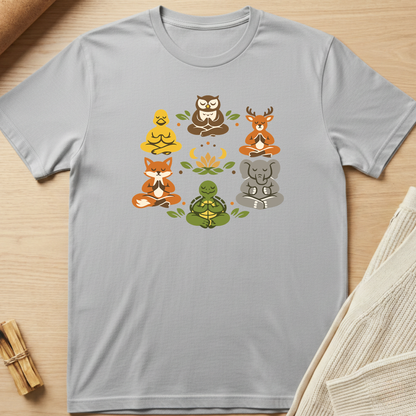 Gray t-shirt with animal illustrations on a wooden surface. Minimalist yoga apparel by pemuyo.