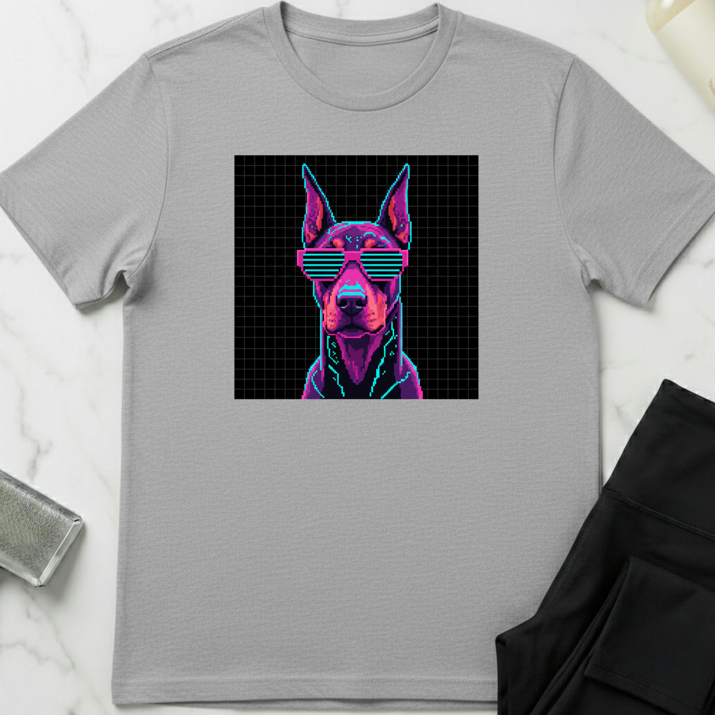 Gray t-shirt with a graphic of a dog wearing sunglasses on a black background. Minimalist dog apparel by pemuyo.