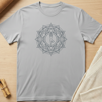 Gray t-shirt with a geometric design on a wooden surface. Minimalist yoga apparel by pemuyo.