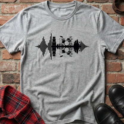 Gray t-shirt with black drum set graphic on a brick background. Minimalist music apparel by pemuyo.