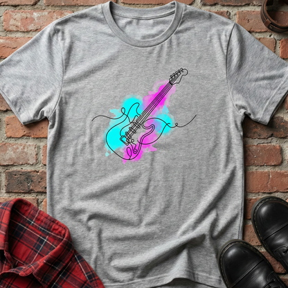 Gray t-shirt with a colorful guitar design on a brick surface. Minimalist music apparel by pemuyo.