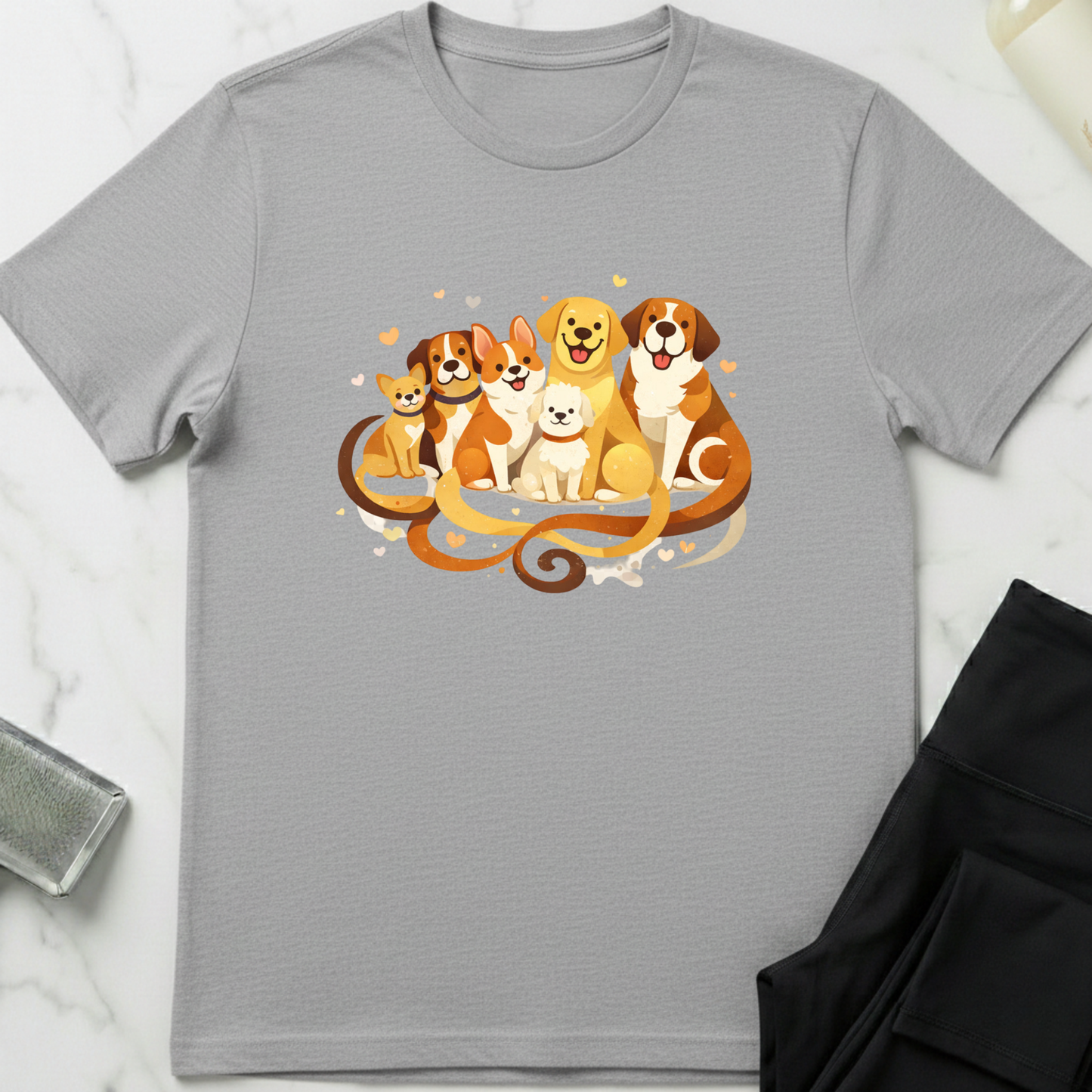 Gray t-shirt with a colorful graphic of dogs on a white marble surface. Minimalist dog apparel by pemuyo.