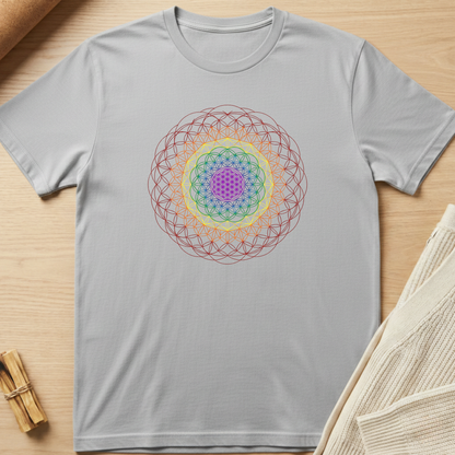 Gray t-shirt with a colorful geometric design on a wooden surface. Minimalist yoga apparel by pemuyo.