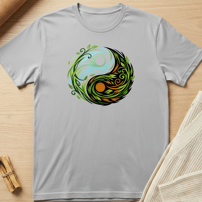 Gray t-shirt with a colorful yin yang symbol design on a wooden surface. Minimalist yoga apparel by pemuyo.